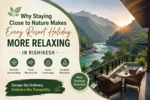 Peaceful nature resort in Rishikesh surrounded by lush green mountains and river views, showcasing a relaxing holiday experience
